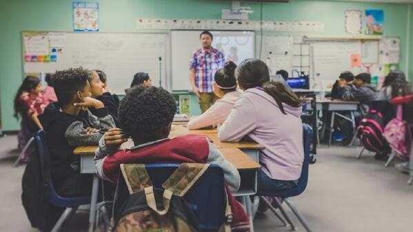 Learners and teacher in classroom
