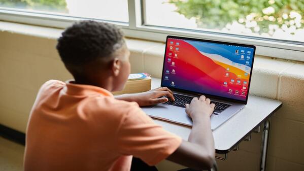 Child in front of a laptop