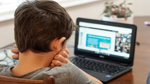 learner using laptop to learn online