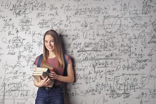 girl holding books