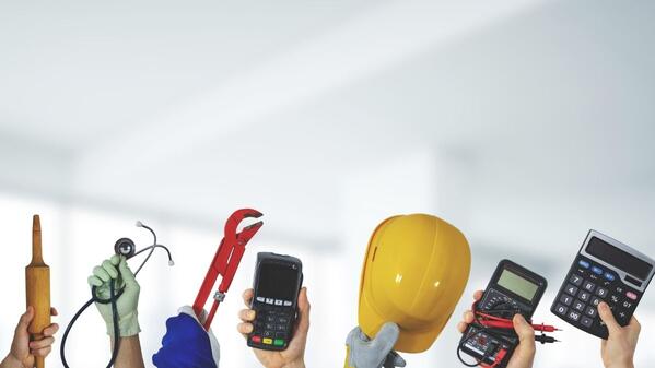 People holding their employment equipment in the air